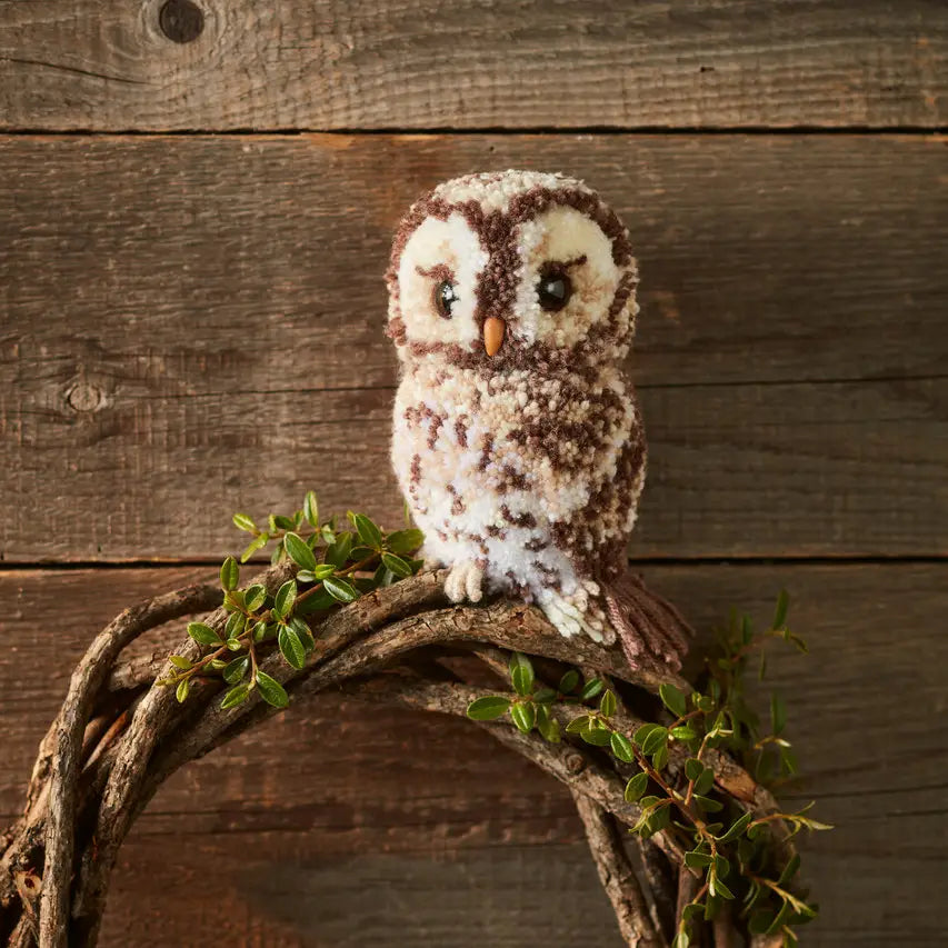a brown and white owl made with pompoms