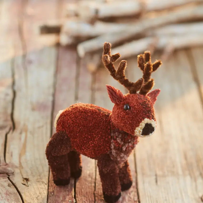 a brown pom pom reindeer