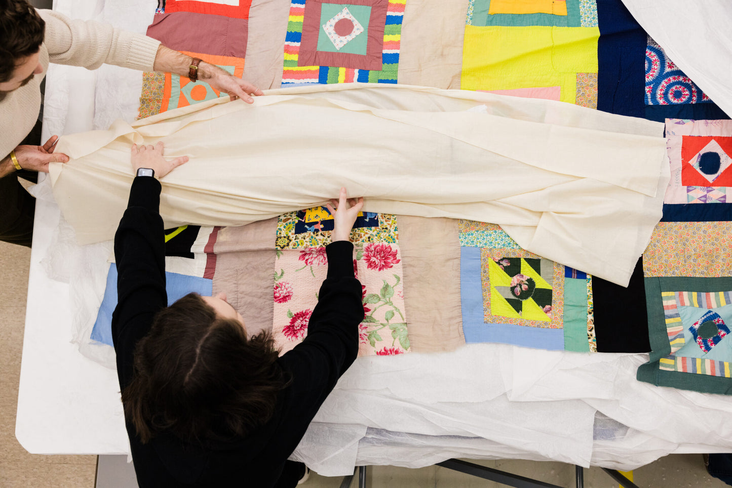an overhead view of a pile of quilts