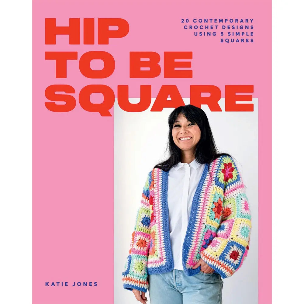 a woman wearing a colorful granny square cardigan