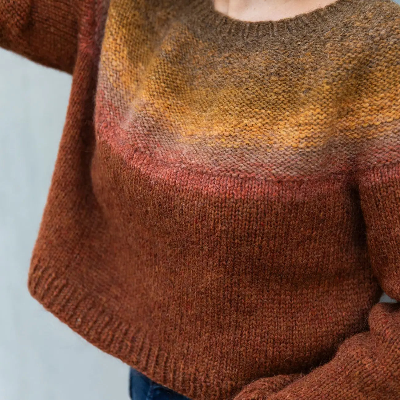 a brown sweater with a garter stitch scrappy yoke