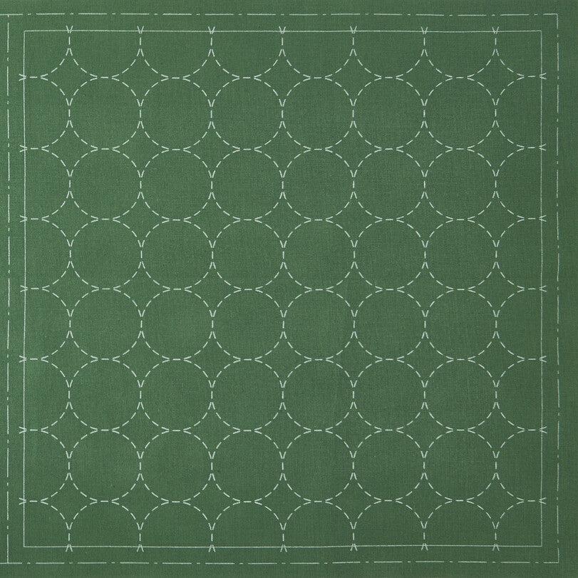 cotton linen sashiko cloth printed with circles on a green background