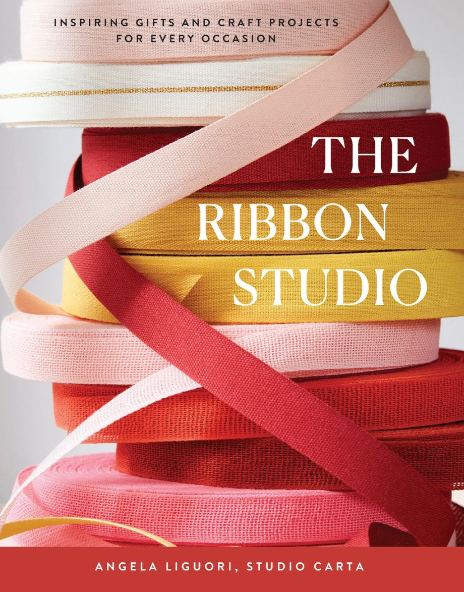 a stack of colorful ribbons on a book cover