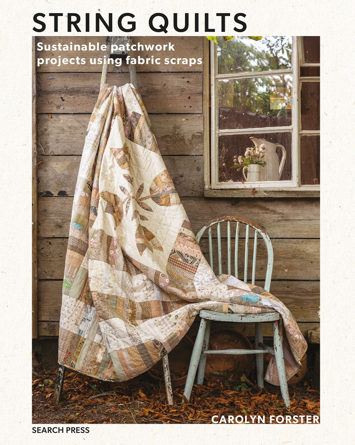 A patchwork quilt in neutrals