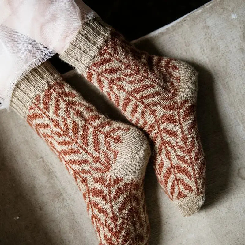 a pair of tan and orange socks