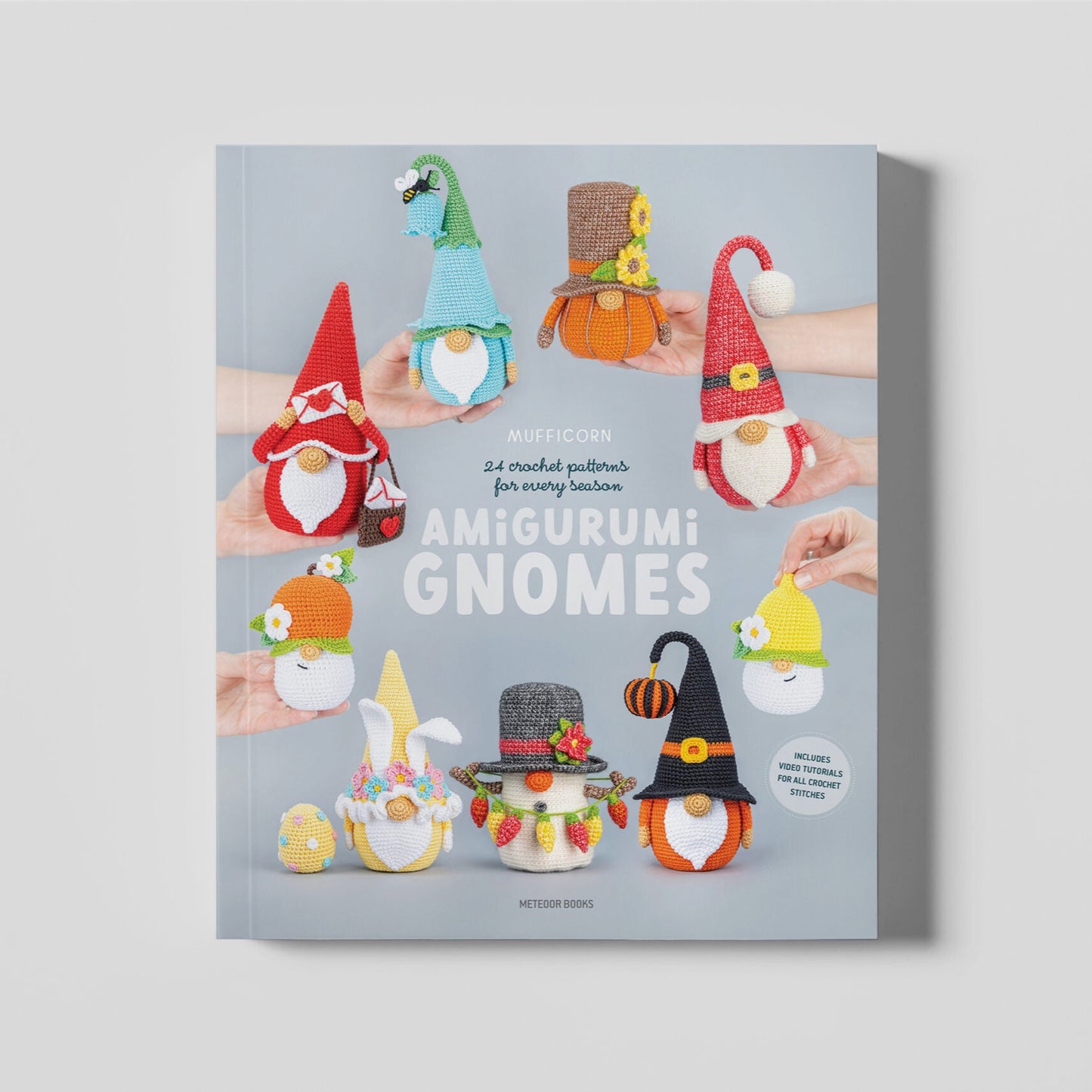 Book cover with illustrations of amigurumi gnomes on a gray background