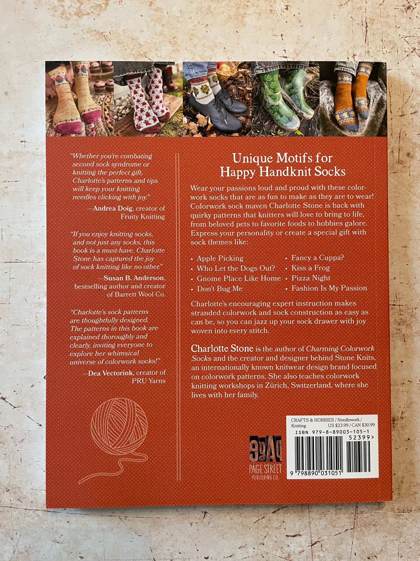 Book back cover with text and images of knitted socks on a textured surface