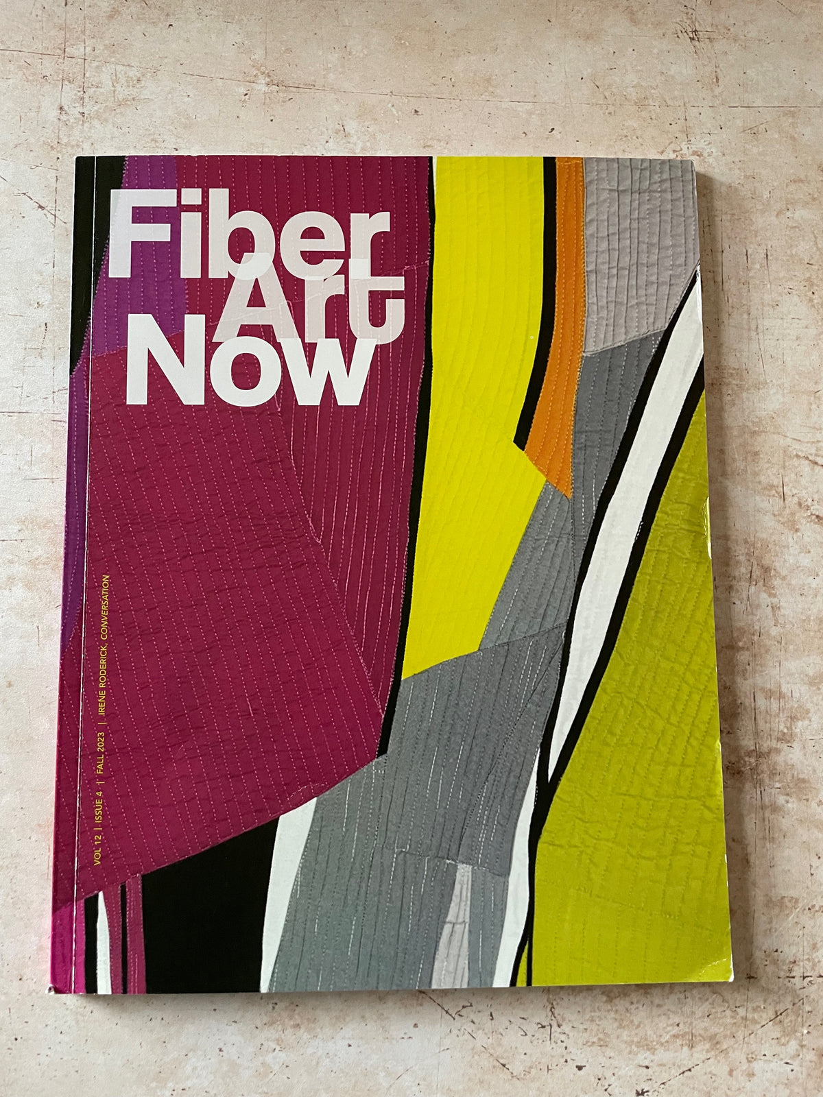 a fabric collage on the cover of Fiber Art Now