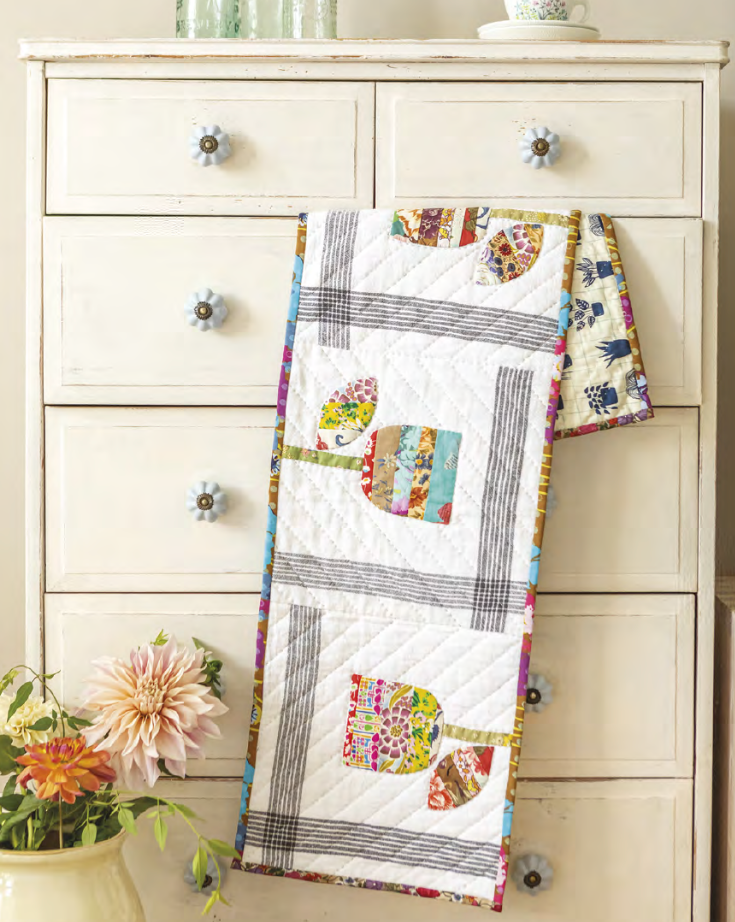 A tulip quilt made with scraps
