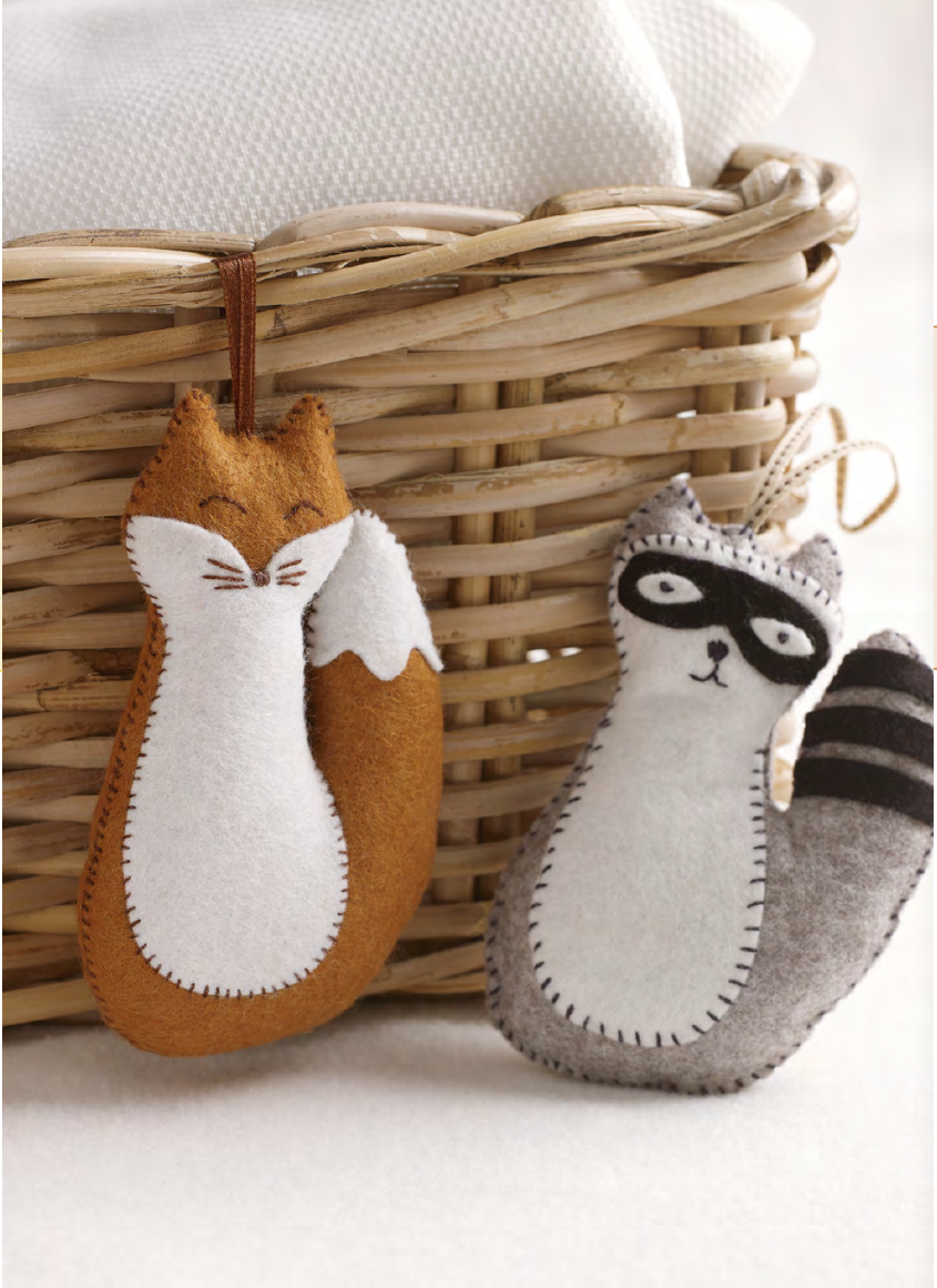 A felt fox and raccoon