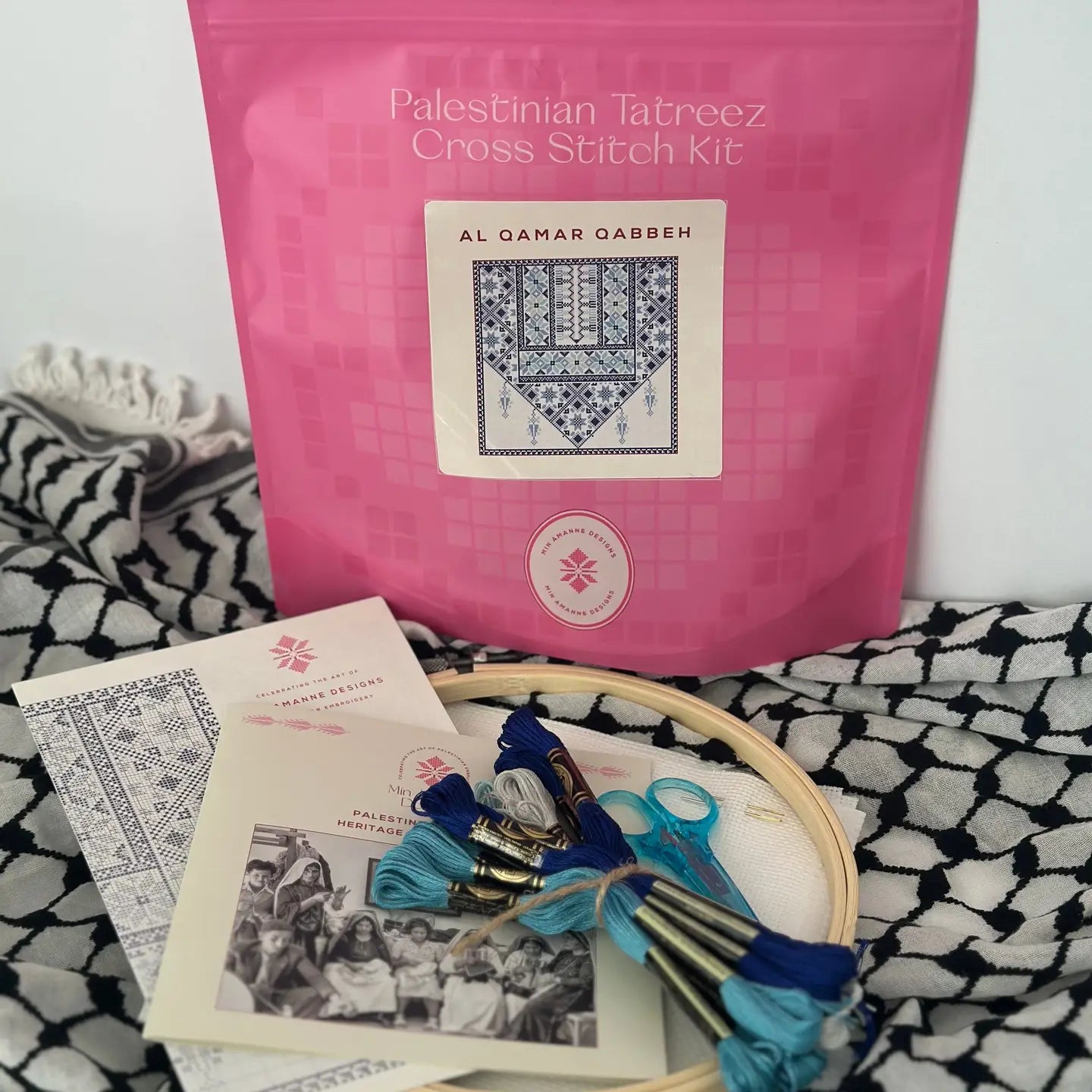 a cross stitch kit with blue thread