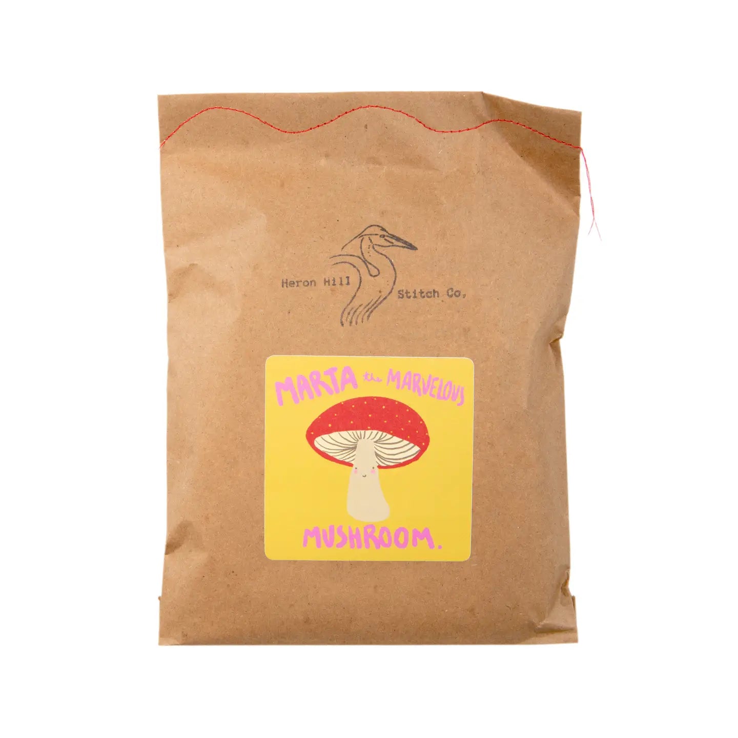 Brown bag package of felt mushroom kit
