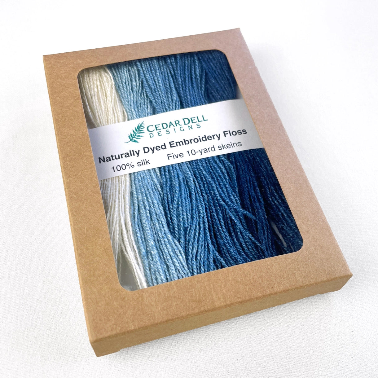 a box containing 5 indigo dyed silk thread