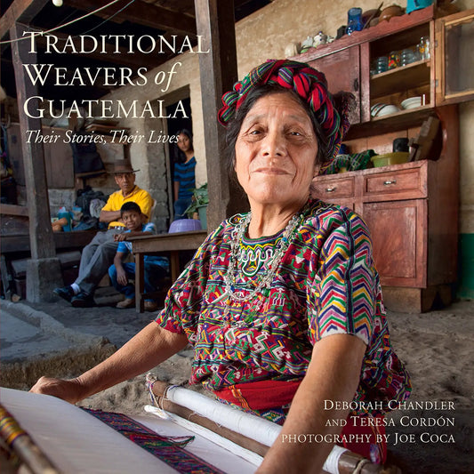 Guatemalan weaver in colorful woven dress