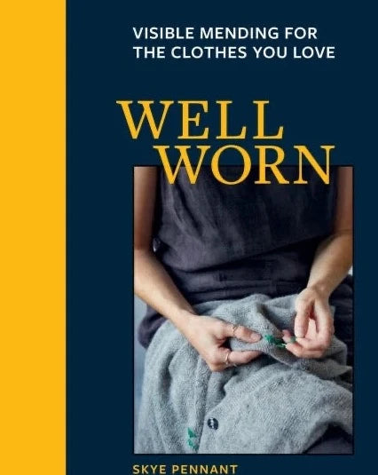 a person mending a shirt