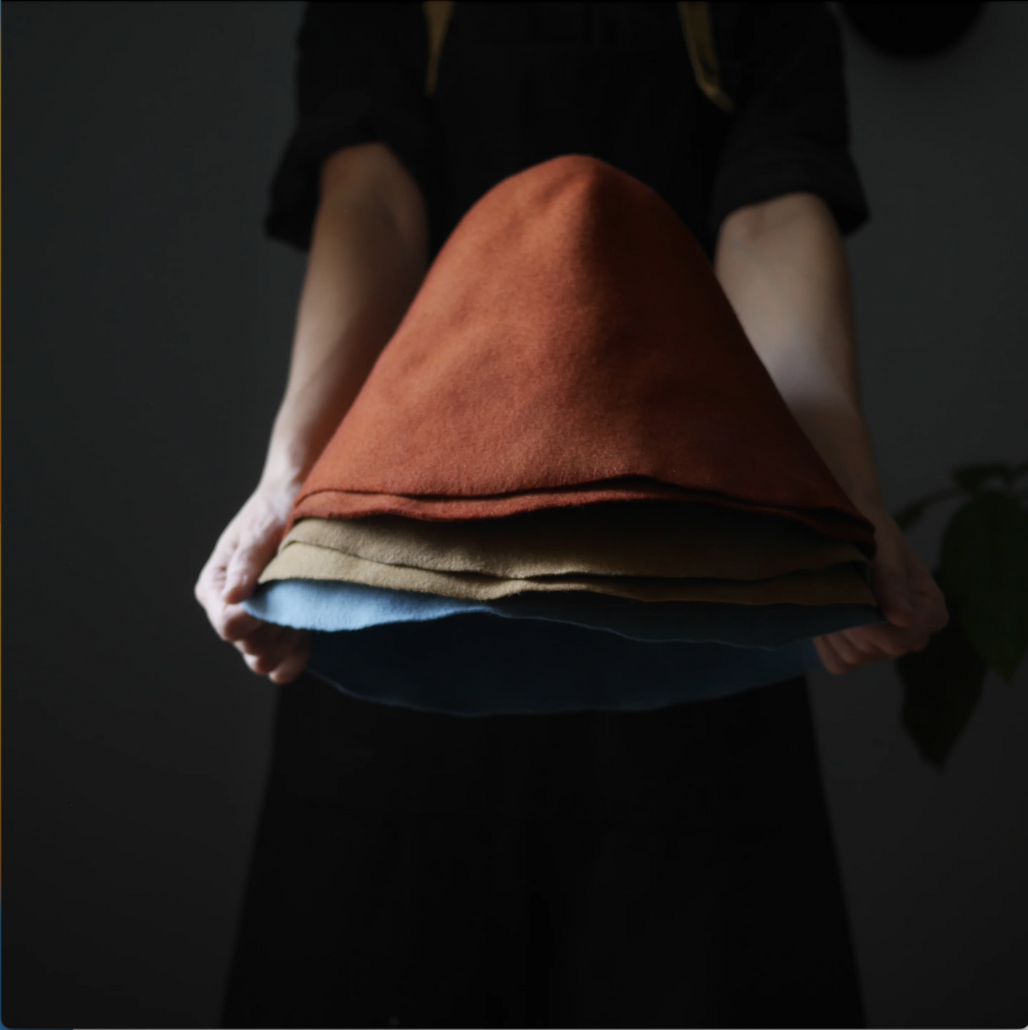 a stack of woolen felt hats