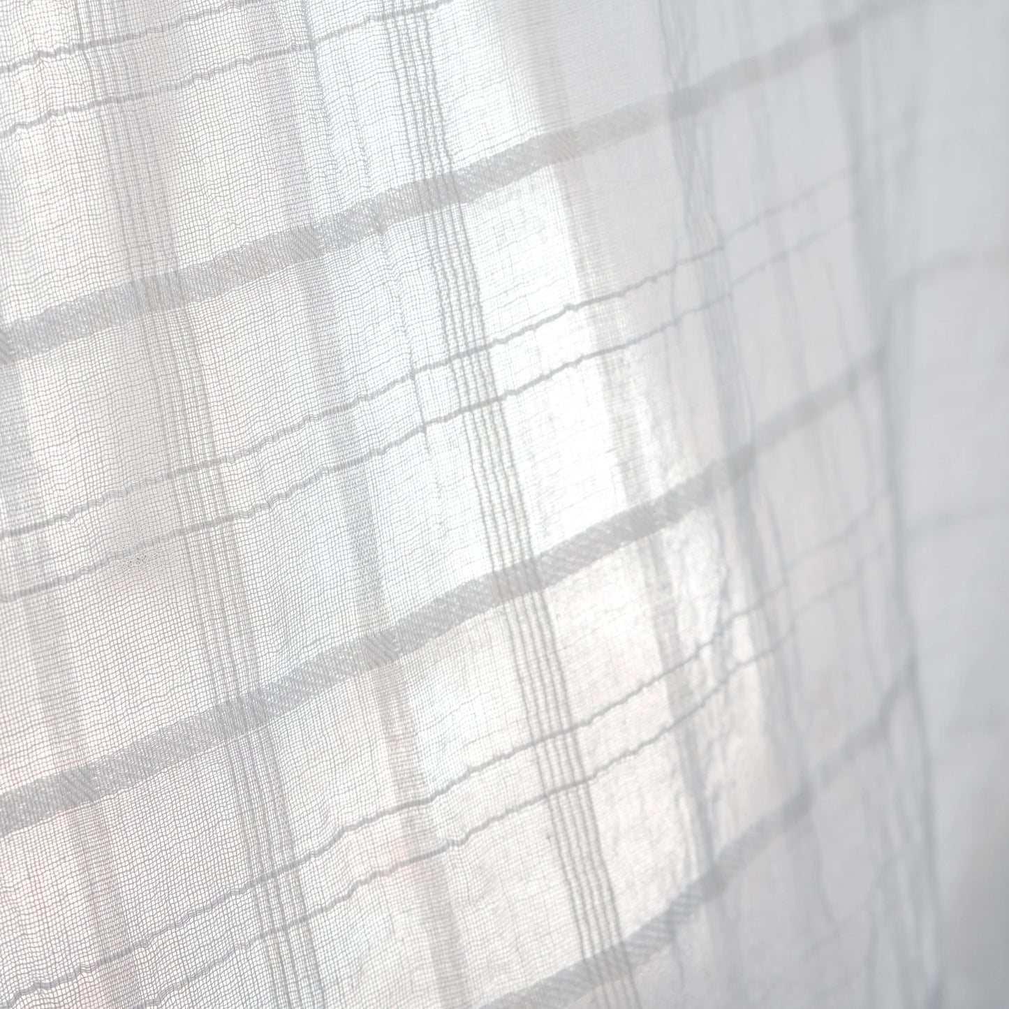 a white lightweight organic cotton scarf