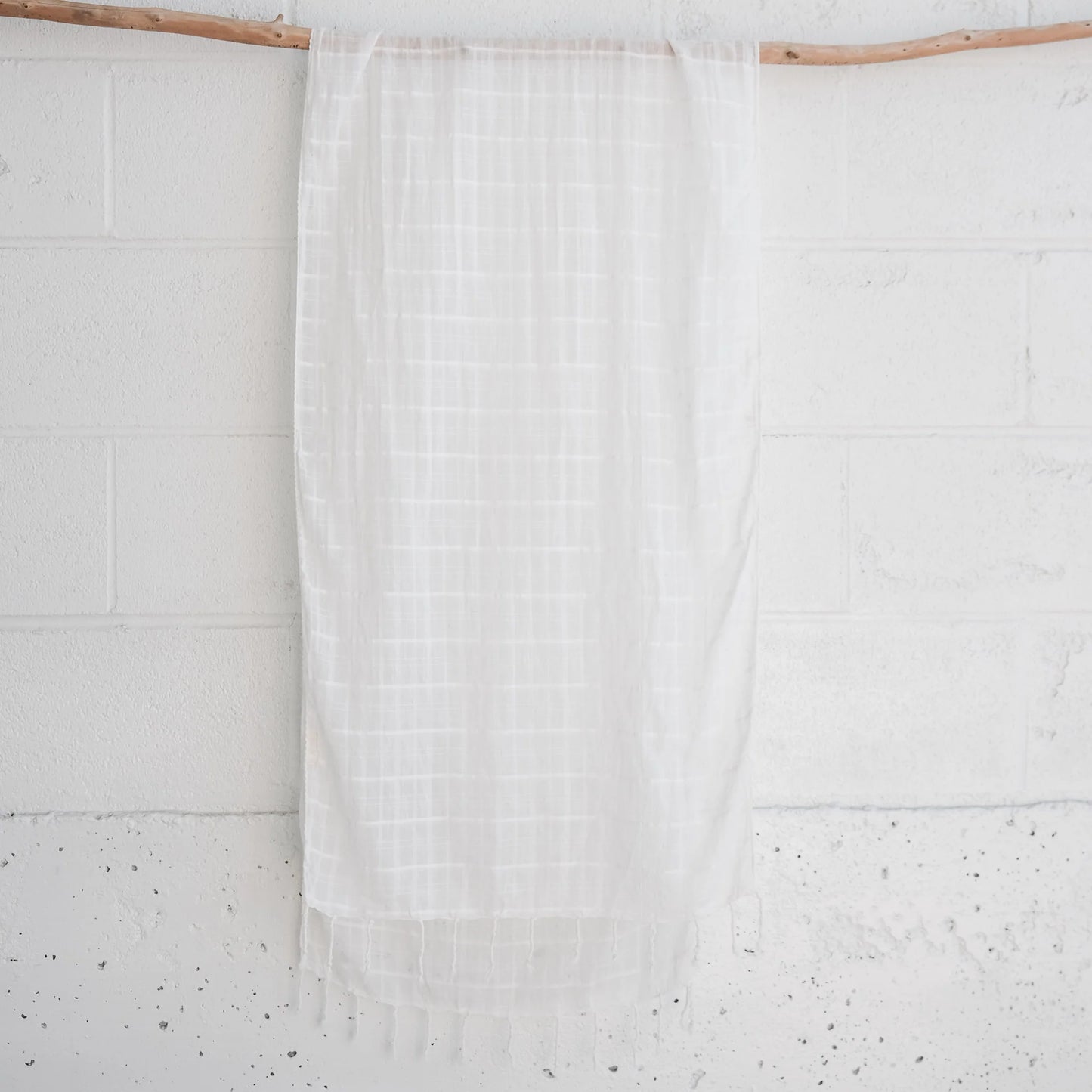 a white lightweight organic cotton scarf