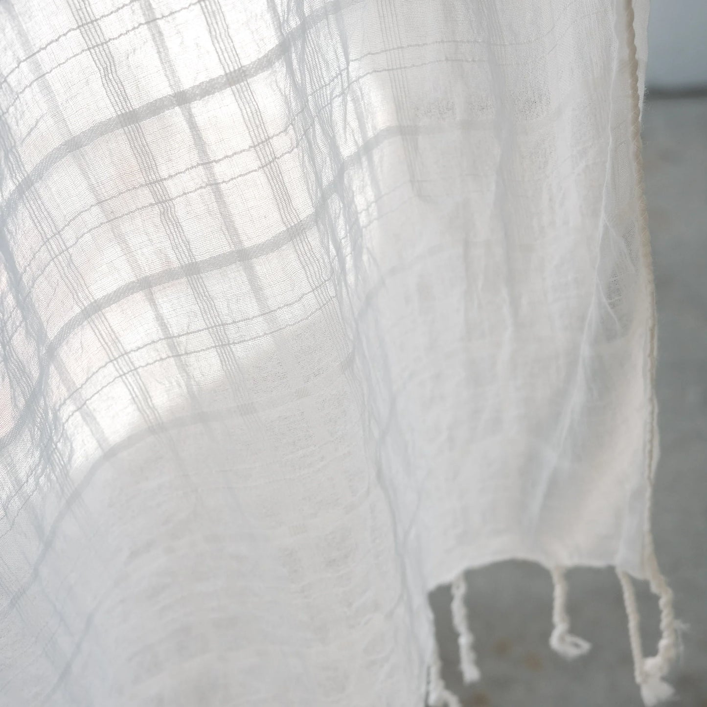a white lightweight organic cotton scarf