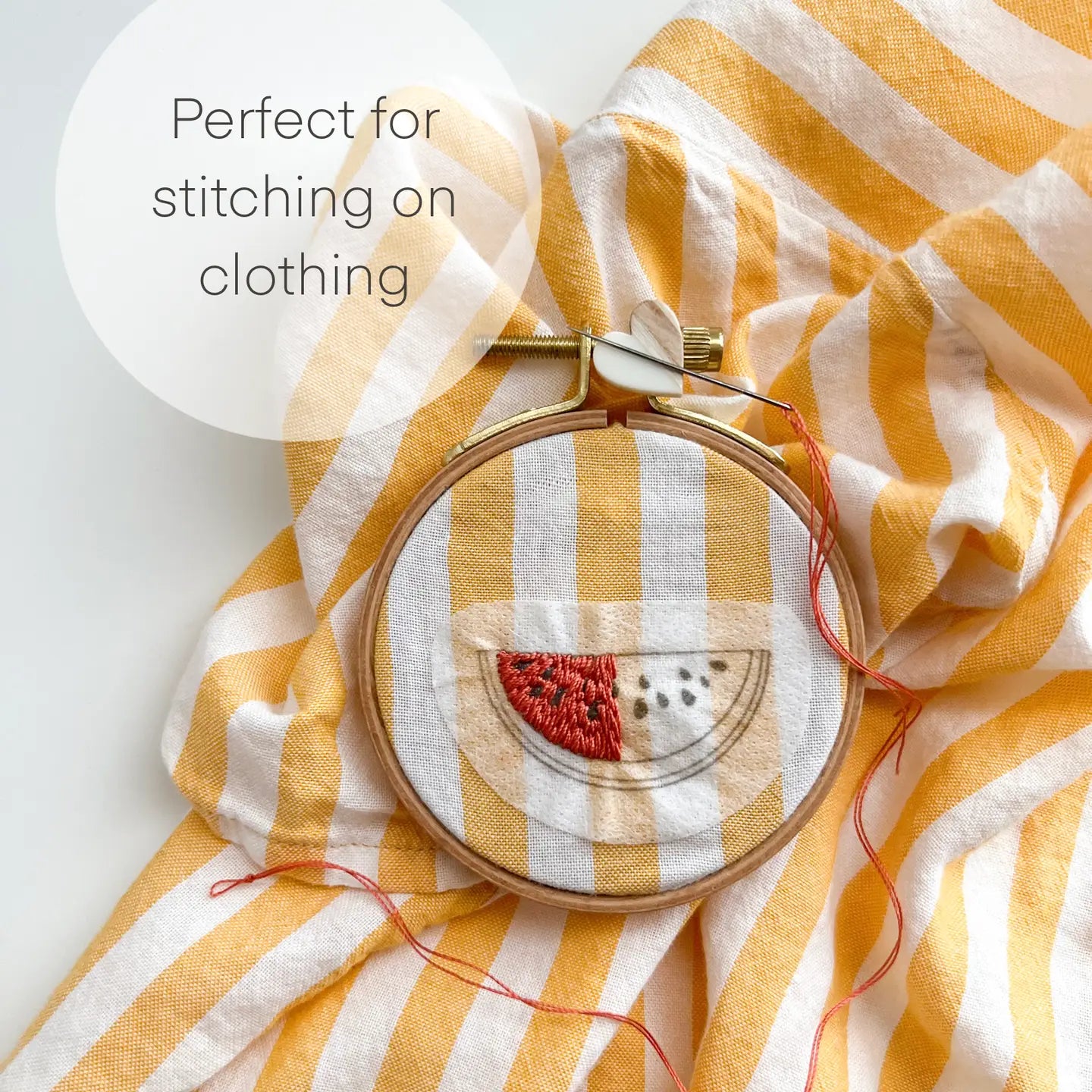 watermelon stitched on yellow striped shirt sleeve
