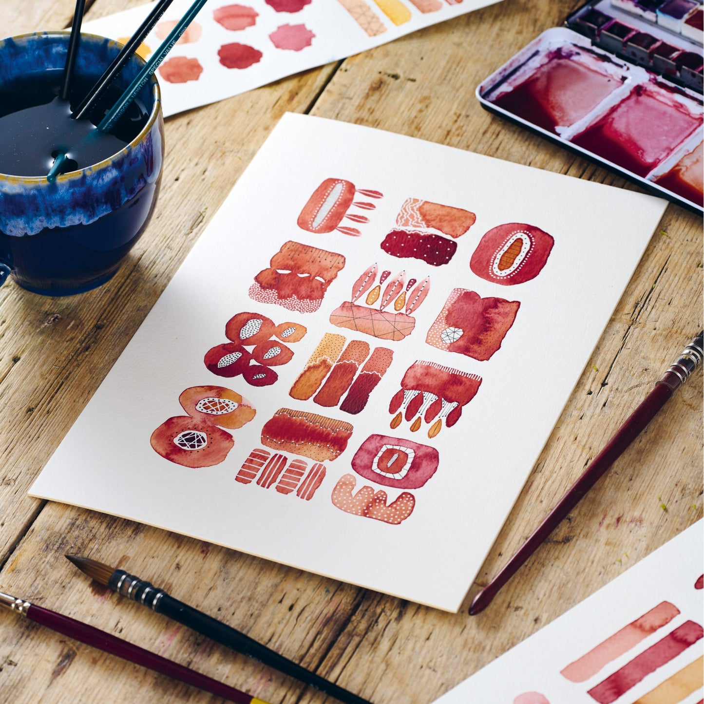 red and orange watercolor shapes