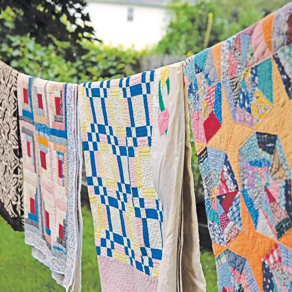 vintage quilts hanging on a clothesline