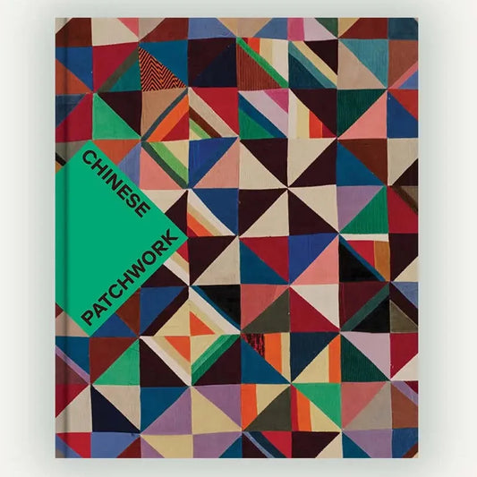 a vibrantly colored patchwork quilt on a book cover