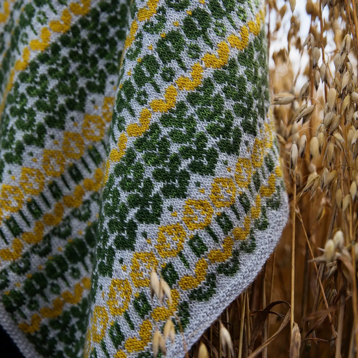 a scarf with yellow flowers and green leaves