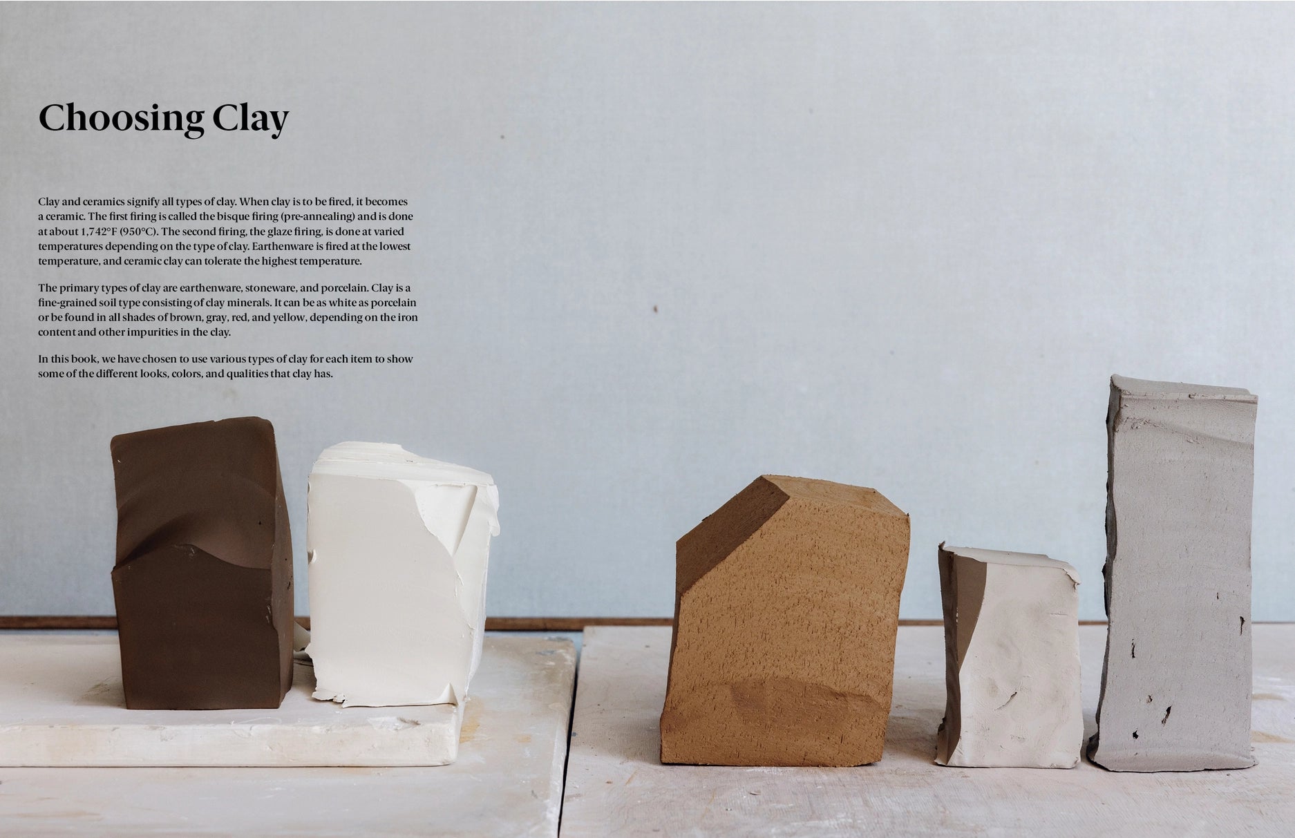 Five different clay blocks on a white surface with a gray background