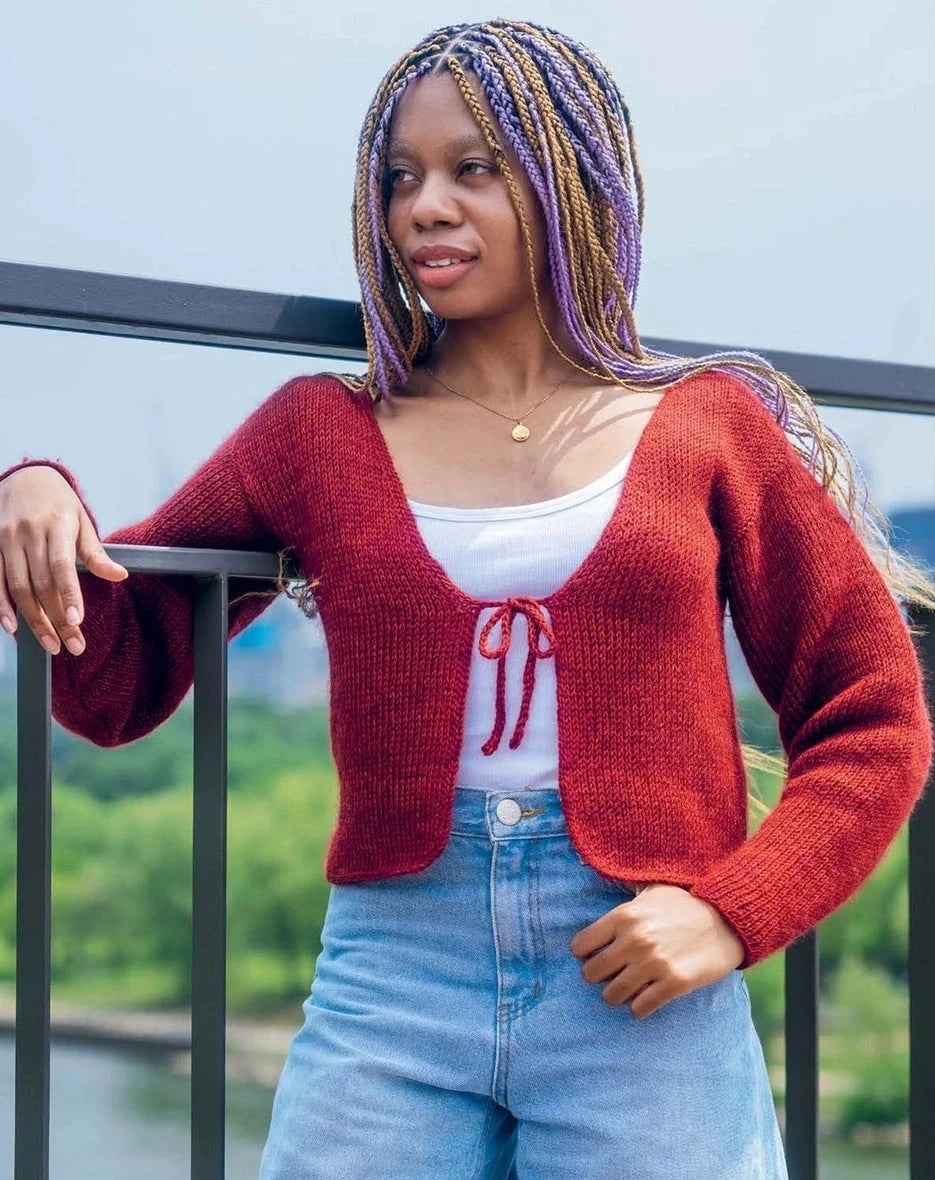 Woman wearing a red cardigan 