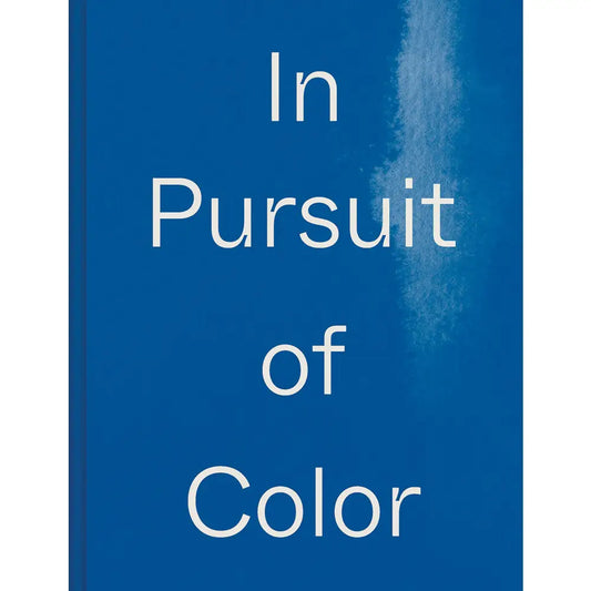 a blue book cover with the title In Pursuit of Color