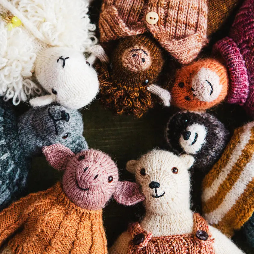 a circle of knitted animals