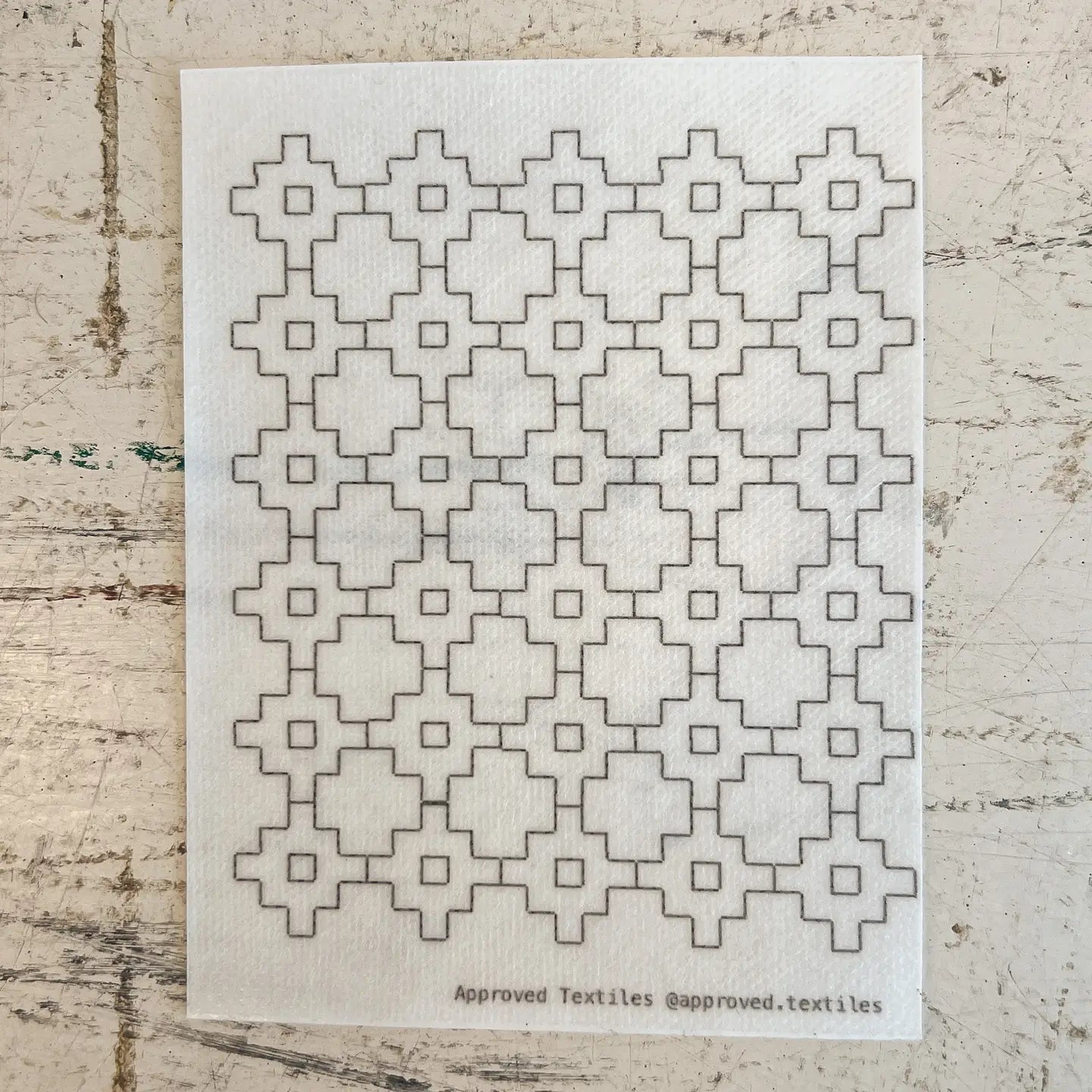 Textile pattern design sheet with geometric pattern on a textured surface