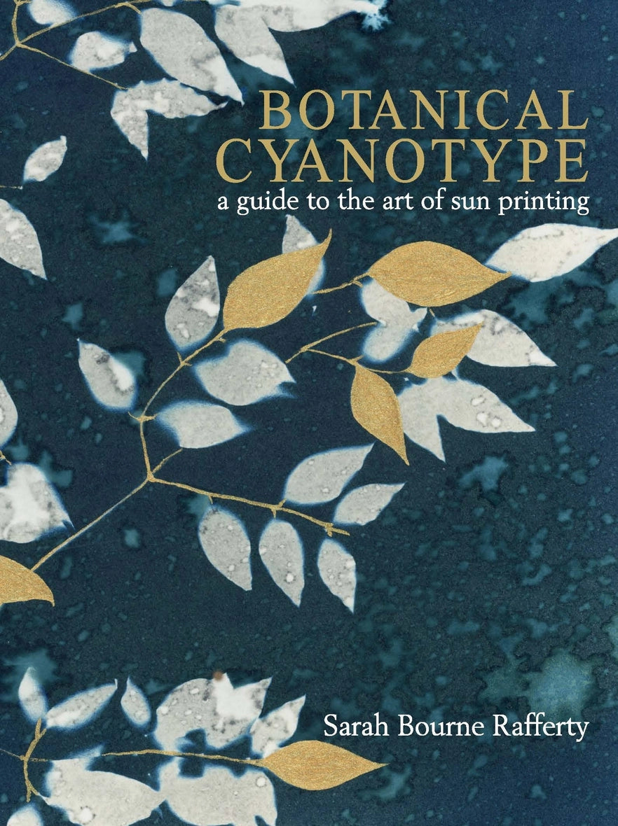 Book cover of 'Botanical Cyanotype' with leaves on a dark background