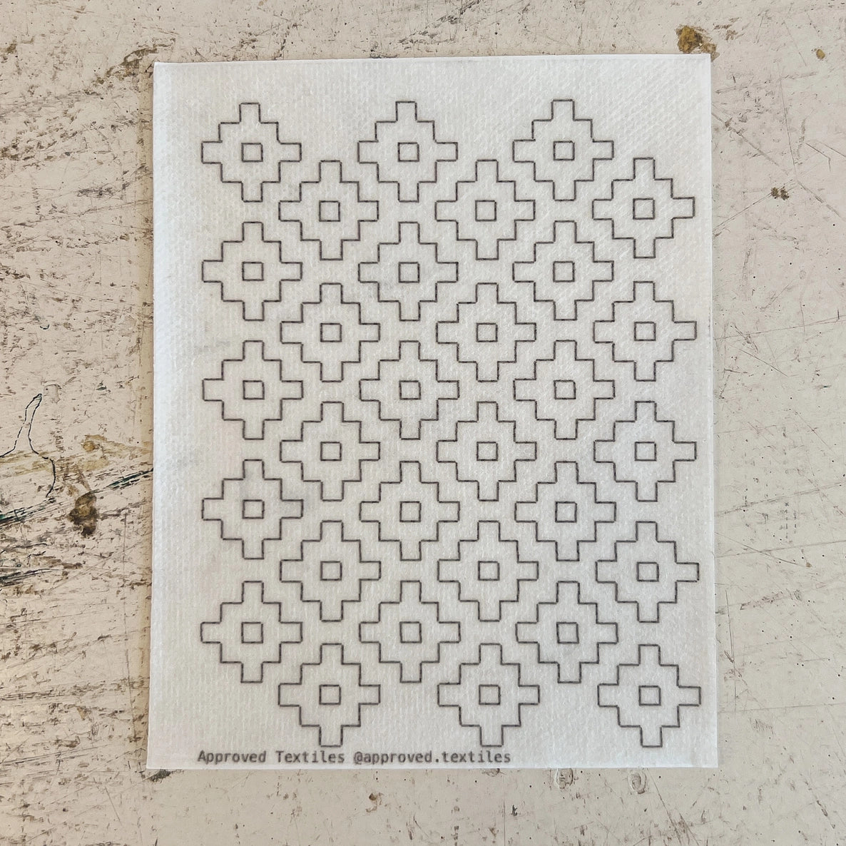 Textile with geometric pattern on a textured surface