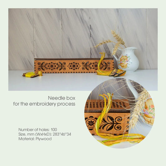 Wooden needle box with embroidery materials on a marble surface
