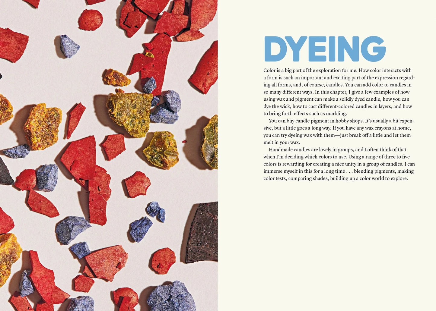 An open book spread showing a page about dyeing candles, with a close-up of colorful wax chunks scattered on the left and a text column titled 'DYEING' on the right.
