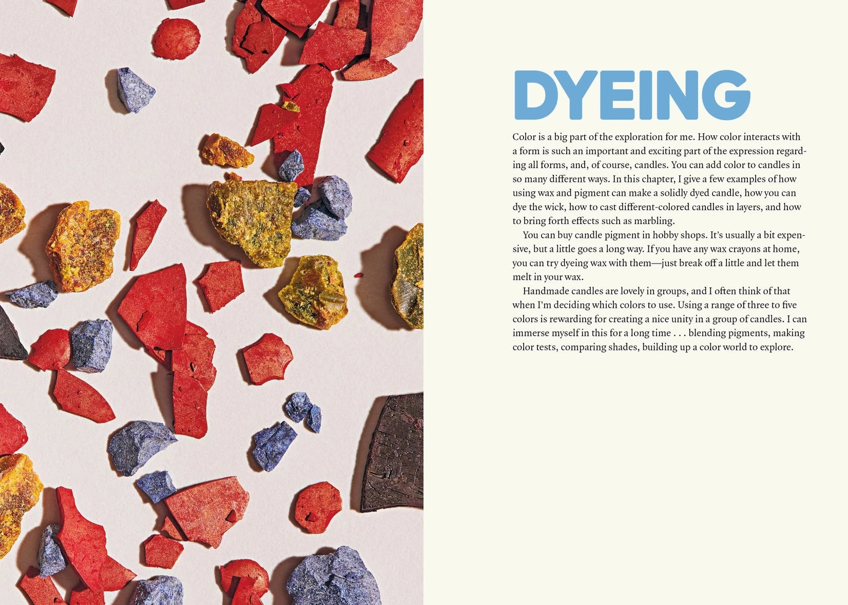 An open book spread showing a page about dyeing candles, with a close-up of colorful wax chunks scattered on the left and a text column titled 'DYEING' on the right.