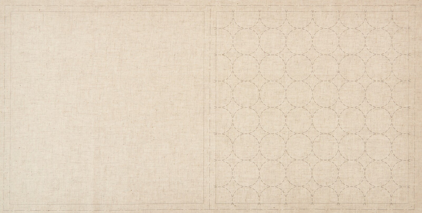 a natural cotton linen cloth printed with circles in a sashiko design