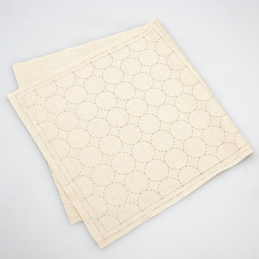 a natural cotton linen cloth printed with circles in a sashiko design