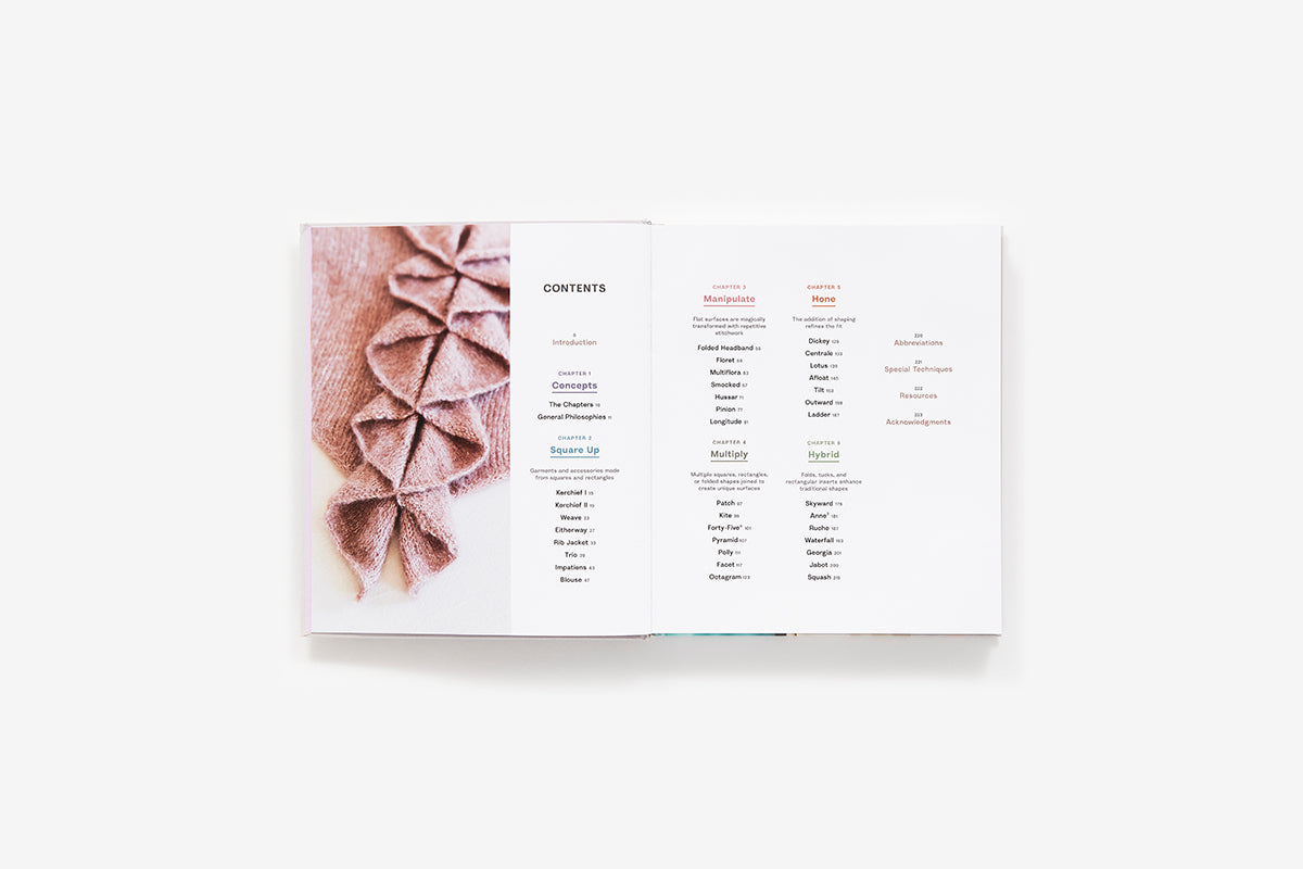 Folded knitwear with a bow design on a white background