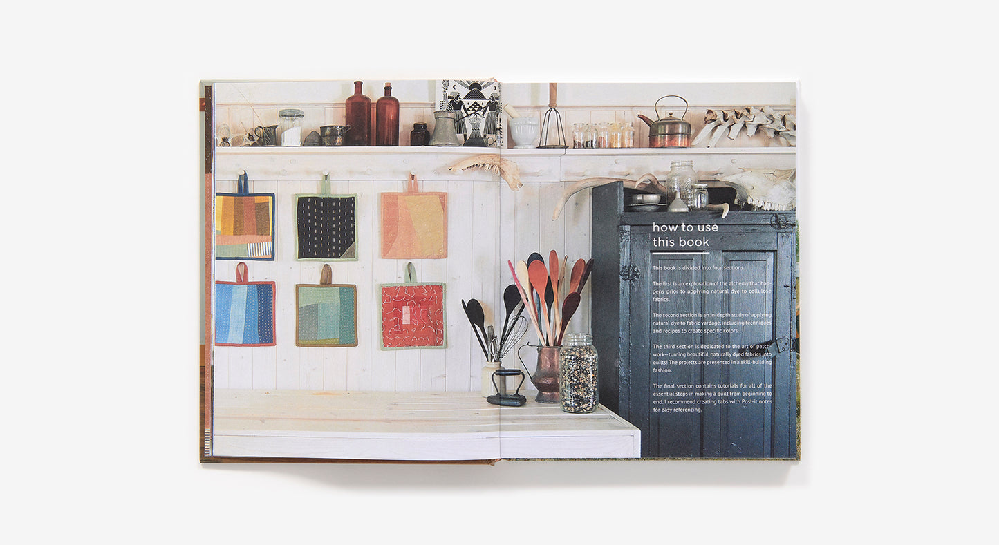 book open to a page with kitchen decor images and text.