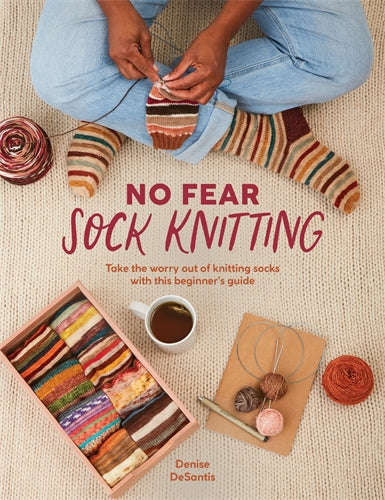  a person knitting and wearing striped socks