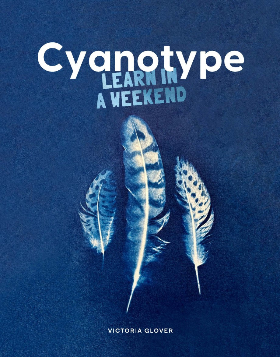 Book cover of 'Cyanotype: Learn in a Weekend' by Victoria Glover with cyanotype feathers on a blue background.