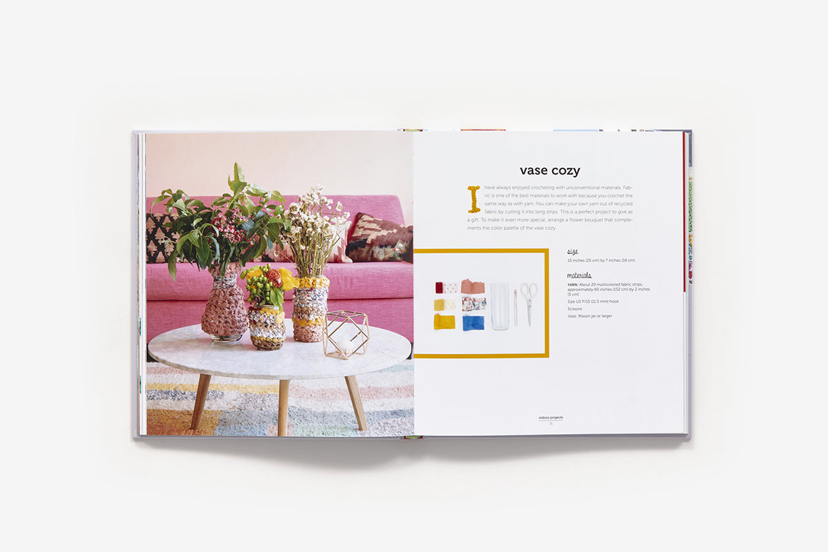 Product catalog page featuring a vase cozy with a pink couch and flowers in the background.