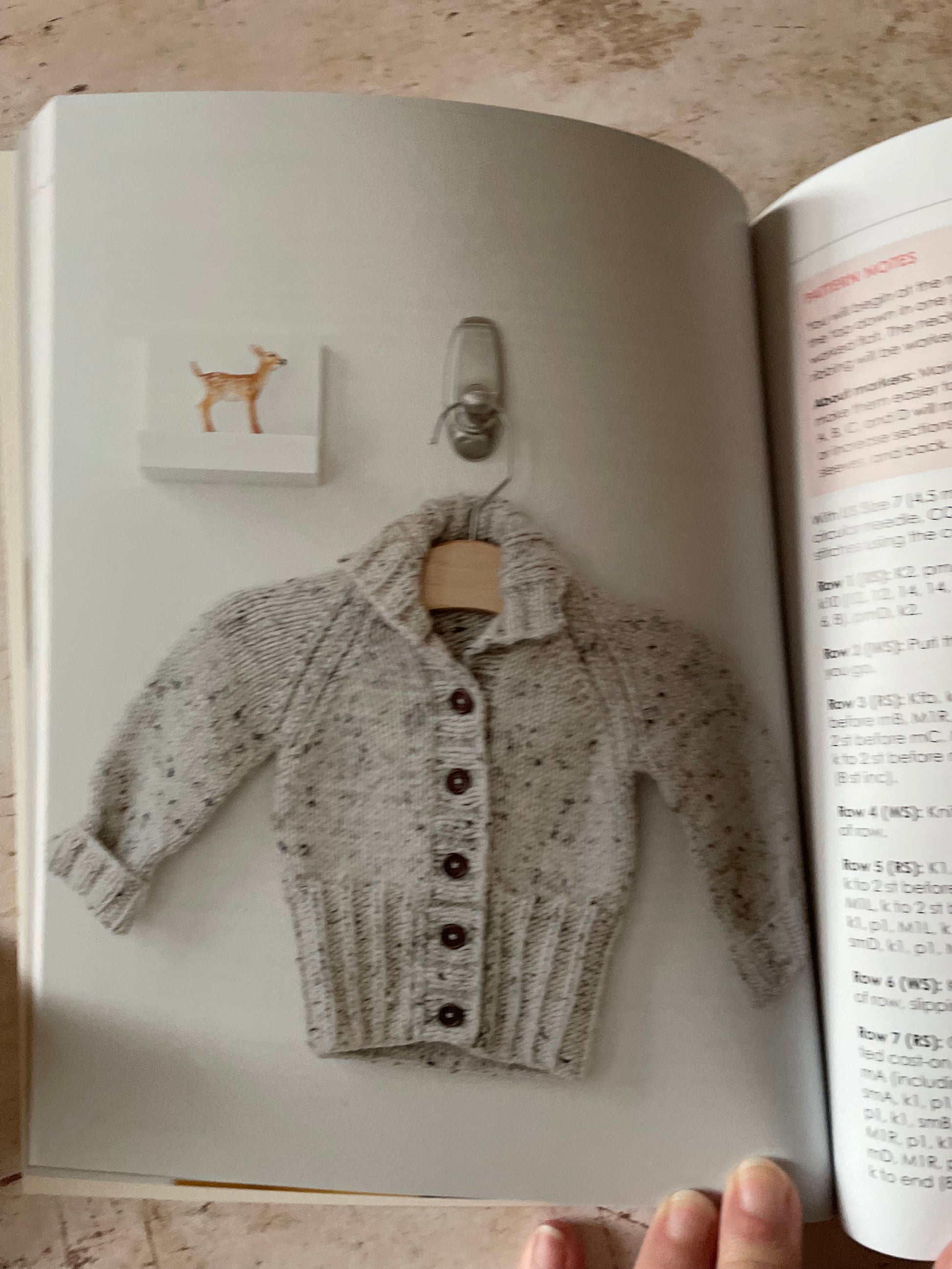 Knitted sweater in a natural and gray speckled yarn