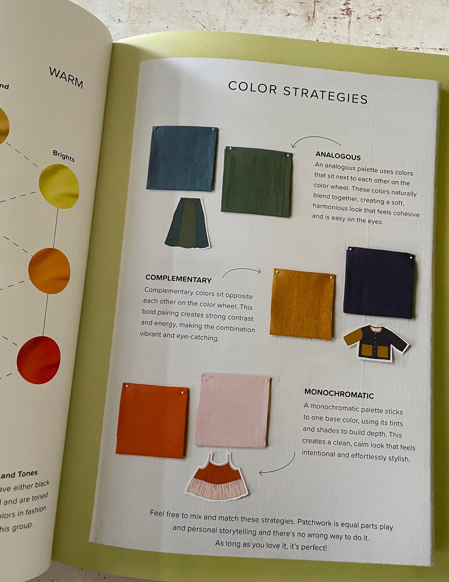 Open book showing pages about color strategies with color swatches and text.