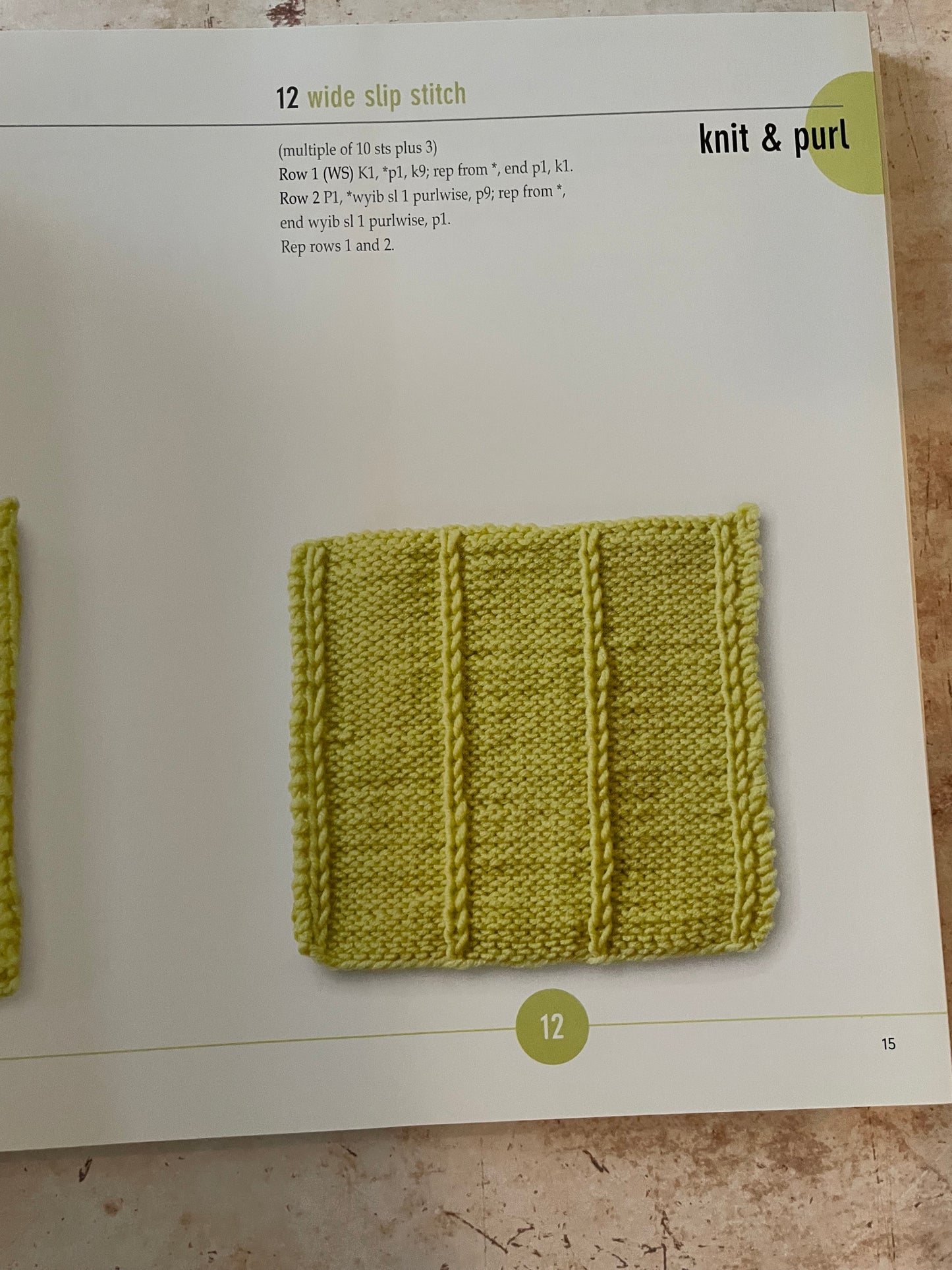Knitted sample on a page from a knitting book