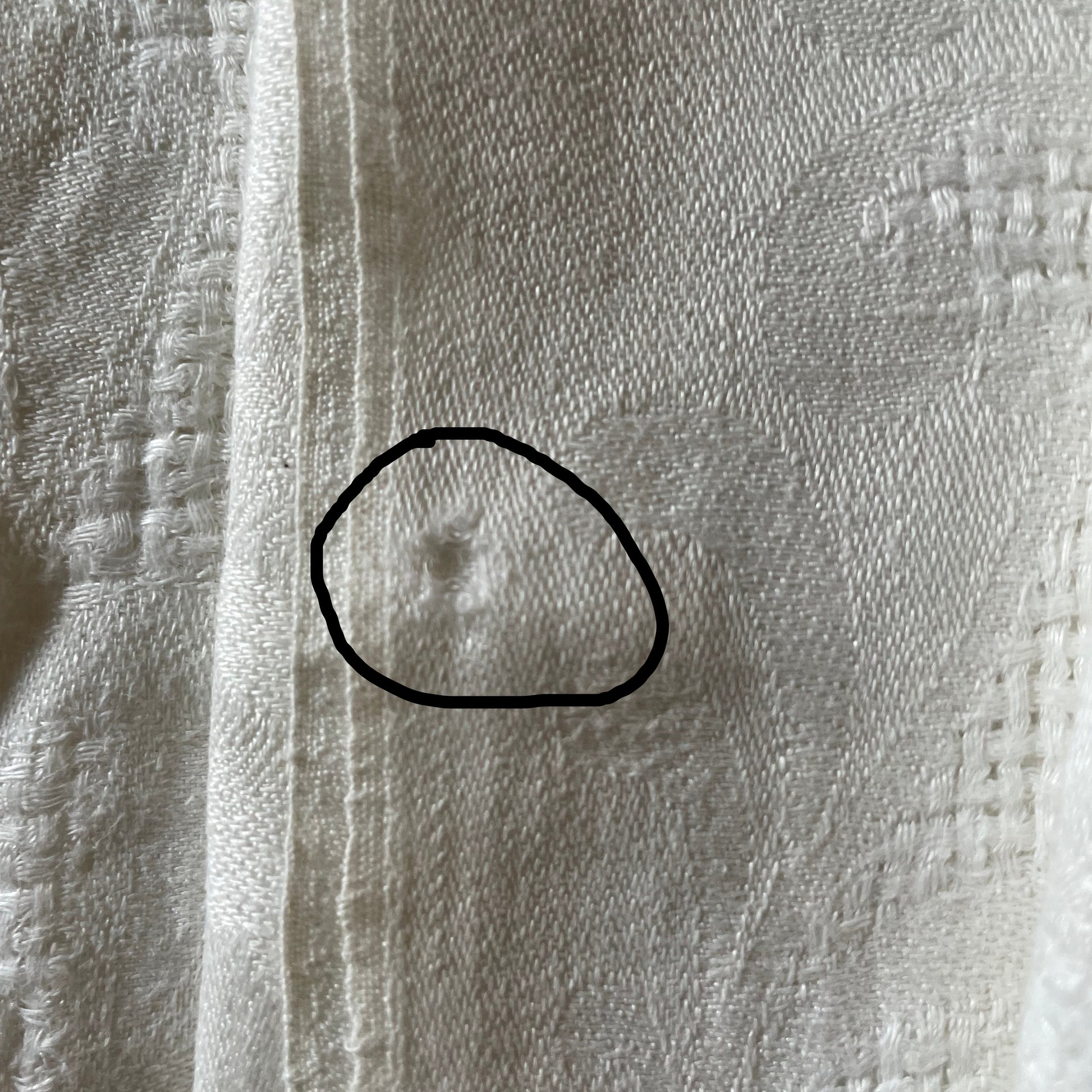 Close-up of textured fabric napkin with a focus on pattern and texture.