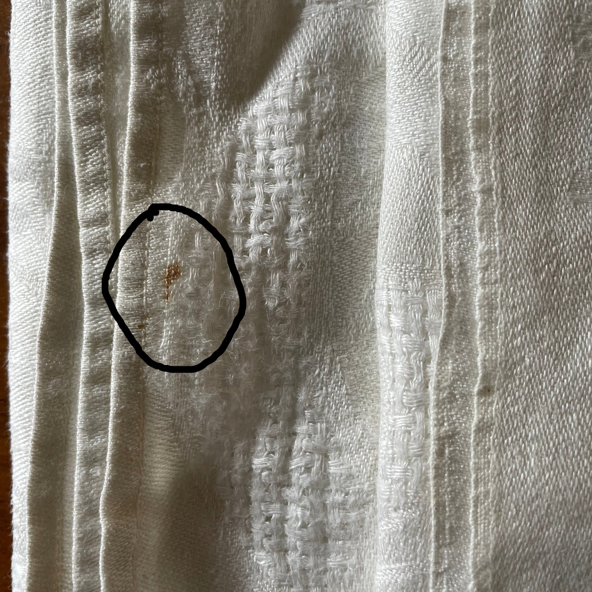 Close-up of a textured fabric napkin  with visible weave pattern